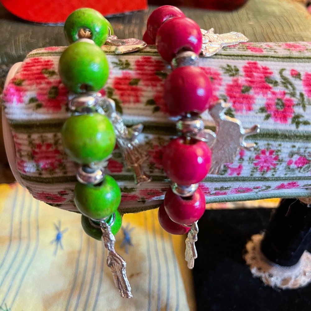 Wood beaded bracelets  with Milagro charms.